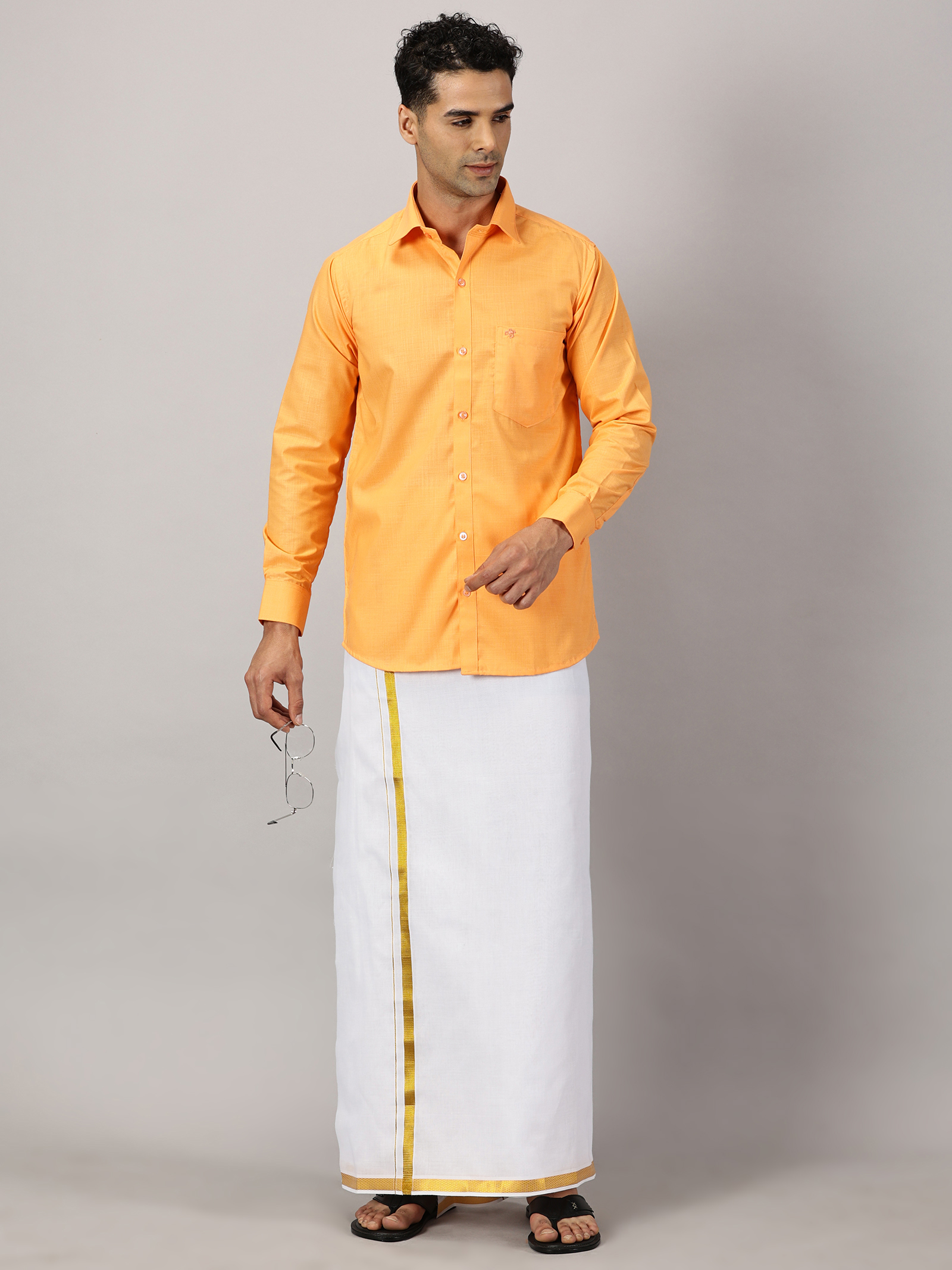 1. Men’s Full Sleeve Shirt Cotton & Dhoti Gold Zari - Combo Set -Saffron - XL Our traditional cotton shirts paired with dhotis bring together heritage and style. Tailored for comfort and crafted for cultural pride, they redefine ethnic elegance.